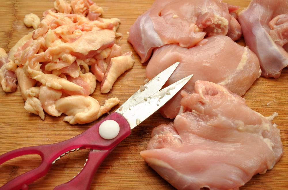 Chicken is cut up before being dredged in flour and fried.