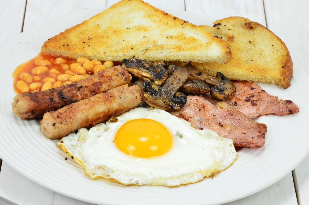 Eggs, toast, sausage, and hash browns are an important part of an English breakfast.