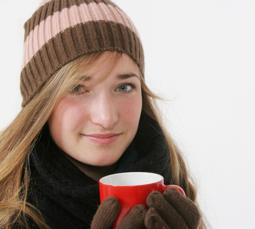 Girl drinking hot mulled cider.