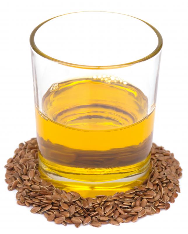Cold pressed flaxseed oil and flax seeds.