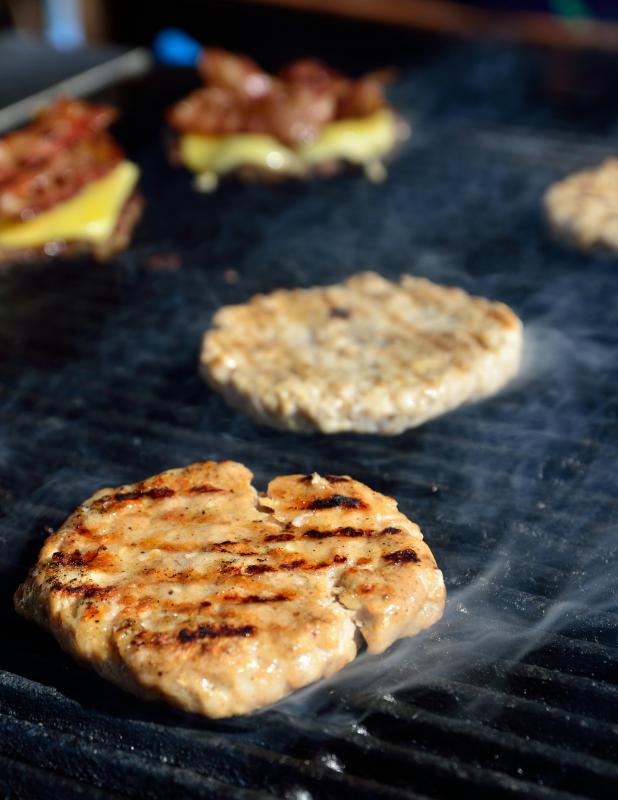 An electric grill is safer to cook meat because it doesn't leave a residue the way charcoal does.