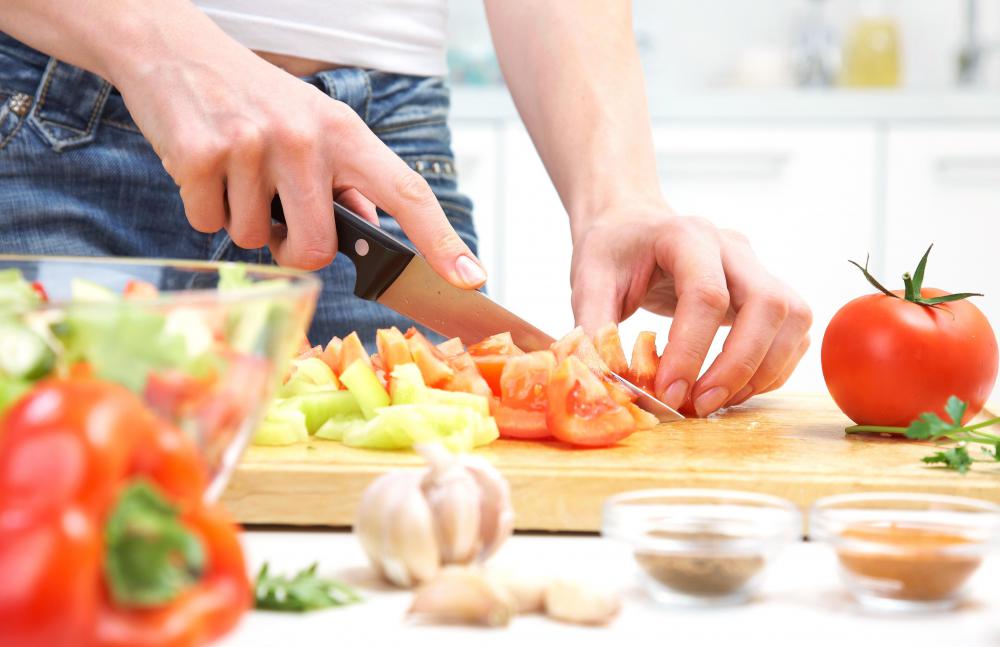 Volunteers usually carry out meal assembly by hand.