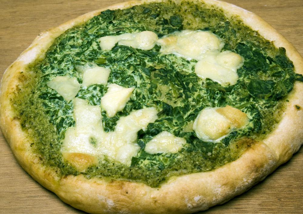 Green pesto can be used instead of red sauce on a pizza.