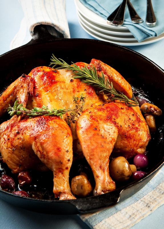 Butterflying a whole chicken will help it cook faster and evenly.