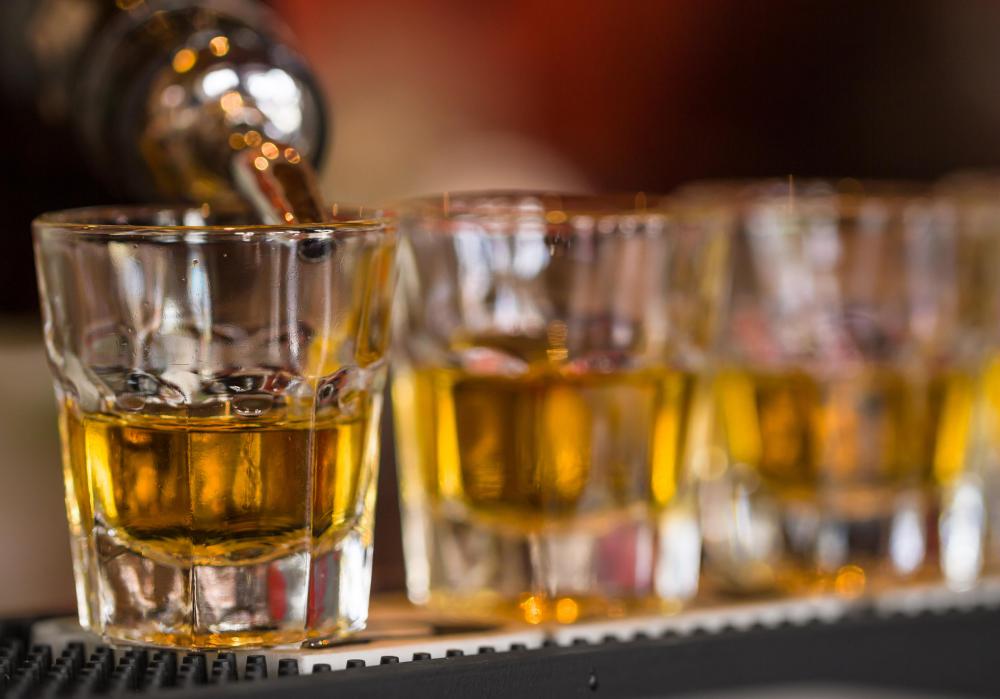 People enjoy drinking alcohol shots with friends and coworkers when going out.