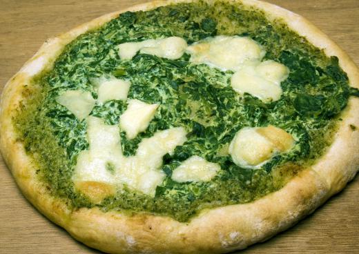 Green pesto can be used instead of red sauce on a pizza.
