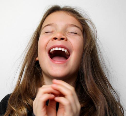 Making sure that your mouth isn't full when laughing is a basic part of table manners.