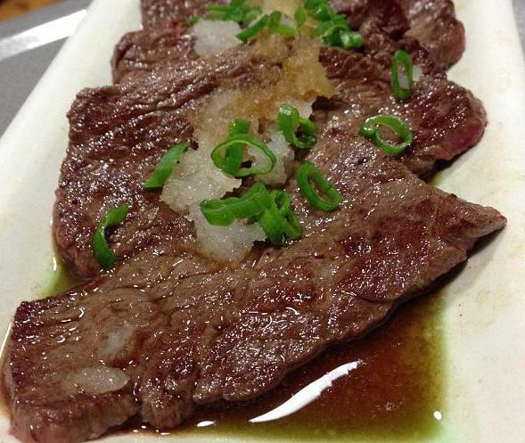 Steak prepared with ponzu sauce.