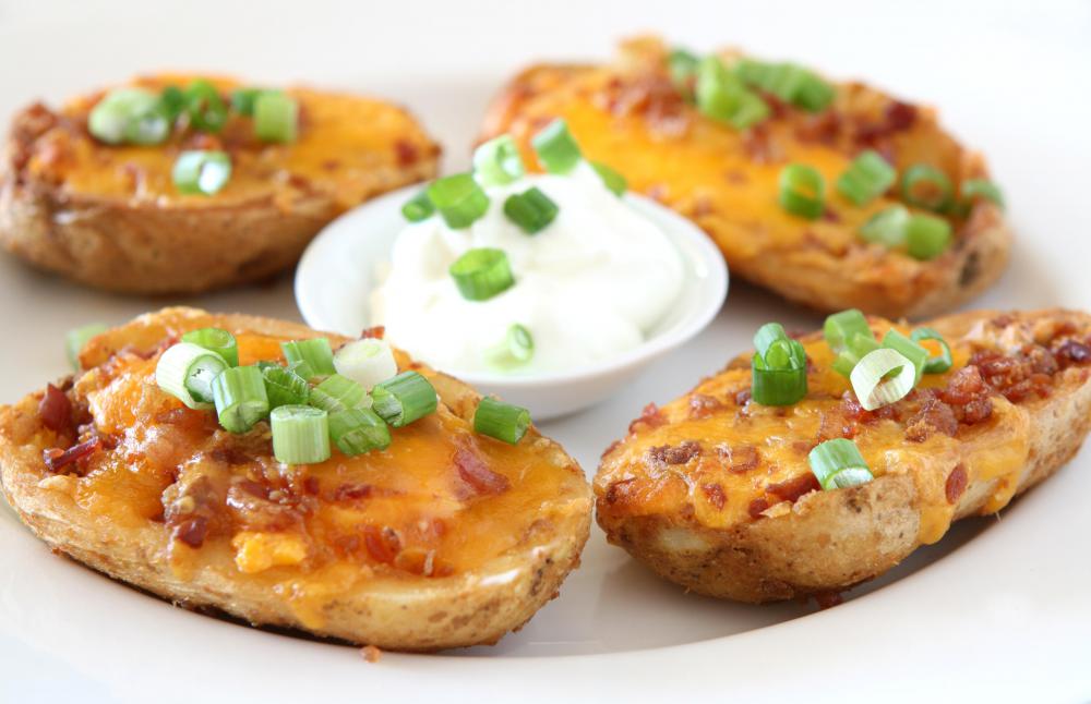 Stuffed potato skins with cheese, bacon, green onions and sour cream.