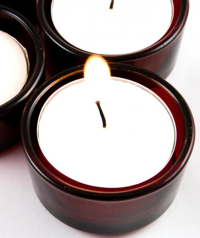 Votive candles may help enhance a table’s overall ambiance.