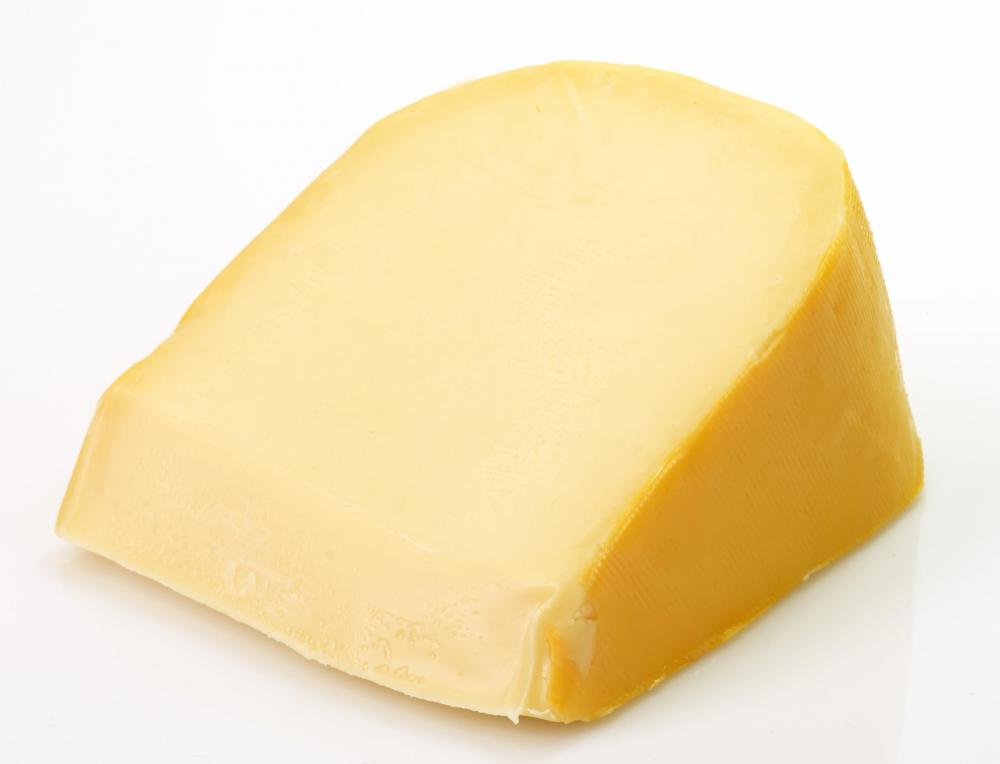 Wedge of gouda cheese.