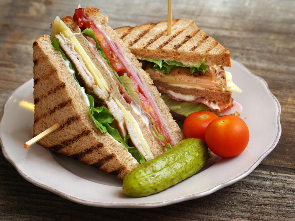 Properly handled slices of leftover turkey combine with bacon for a classic club sandwich.