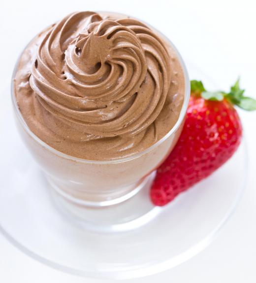 Chocolate mousse and other light dishes are served during the dessert course of a French dinner.