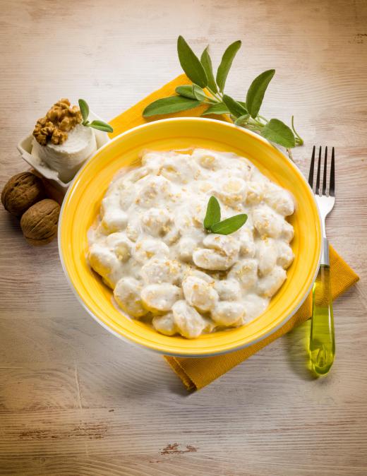 A bowl of gnocchi with Velouté sauce, a creamy french sauce.