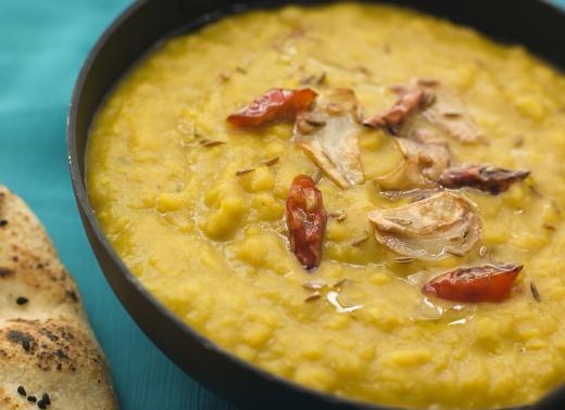 Dhal is typically stewed and flavored with several spices.