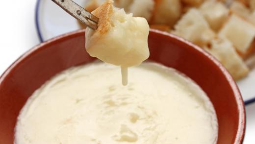 Fondue involves melting cheese or chocolate in a fire pit to use as dipping for other bits of food.