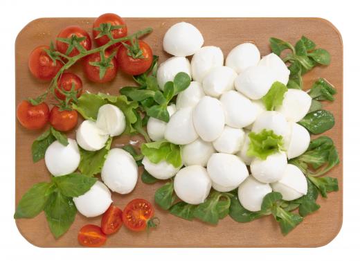 Mozzarella with tomatoes and basil leaves.