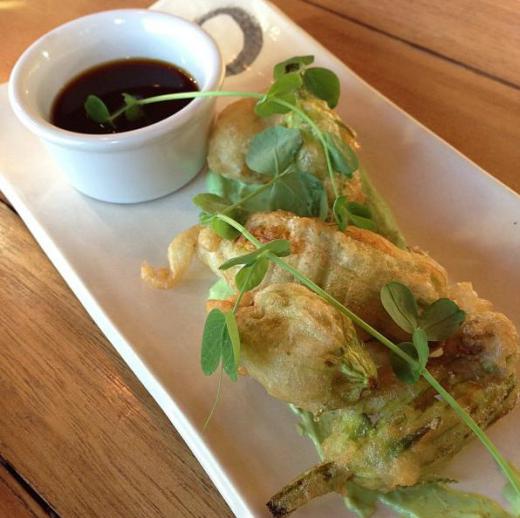 Gyoza is an Asian dumpling served with a sauce.