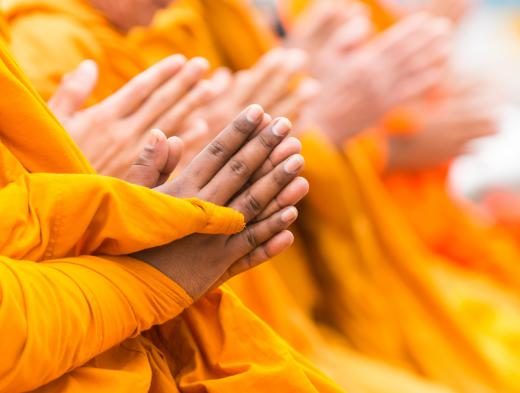 Buddhist monks wear distinctive saffron-colored robes.