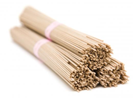 Bundles of uncooked soba noodles, which contain buckwheat.