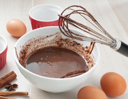 The base layer of chocolate coffee cake is made with flour, sugar, and butter.