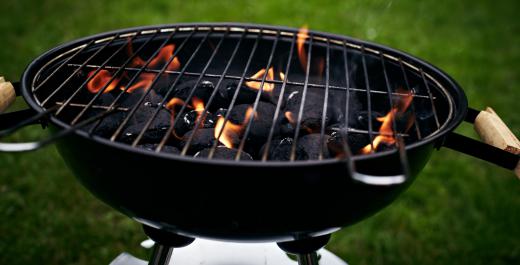 Beef kabobs being cooked on a charcoal grill should be basted with a little marinade as they cook.