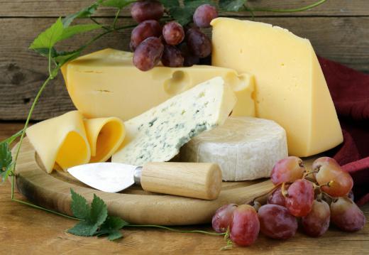 French dinners feature a cheese course with a variety cheeses and accompaniments.