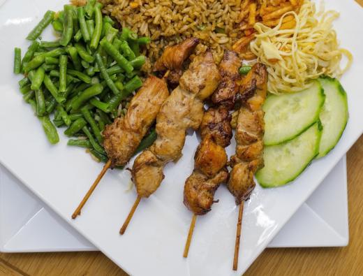 Marinated skewered chicken is often referred to as Satay Madura.