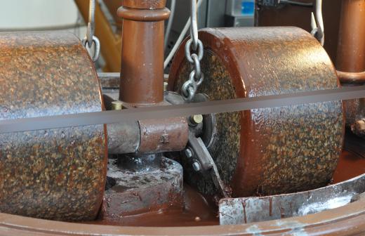 An industrial conching machine making chocolate smooth.