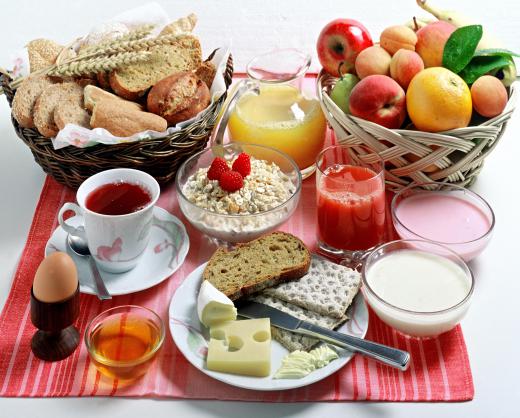 A continental breakfast including breakfast rolls.