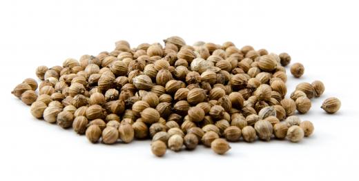 Ground coriander seeds are typically included in Bhajani flour, which is used to make thalipeeth.