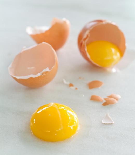 The egg yolk is typically runny with a poached egg.