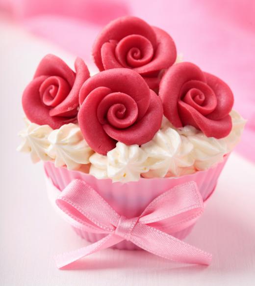 Cupcake decorated with marzipan, a type of almond paste.