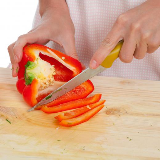 Red bell peppers add additional flavor and color when making a black lettuce salad.