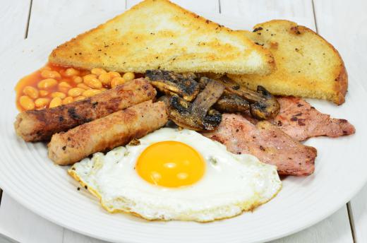 Eggs, toast, sausage, and hash browns are an important part of an English breakfast.