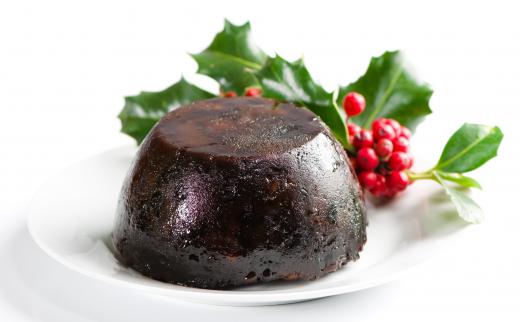 Figgy pudding decorated with holly.