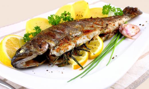 Fish may be fried and served with lemon.