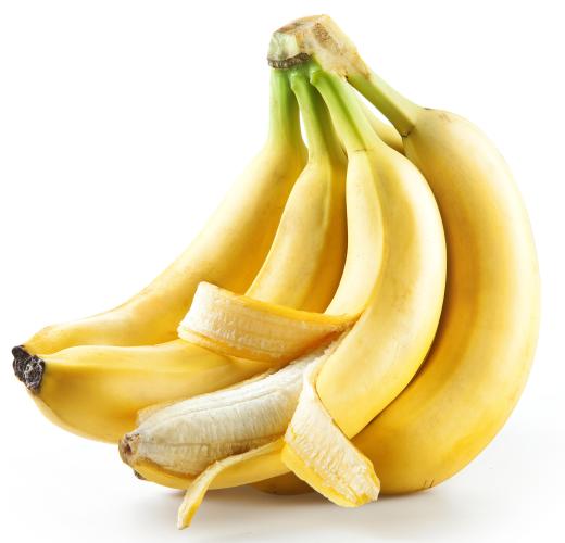 Bananas are boiled in water before being rolled in spring roll wrappers.