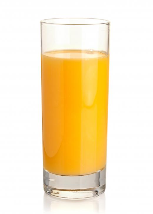 A glass of orange juice, which is used in making a fuzzy navel.