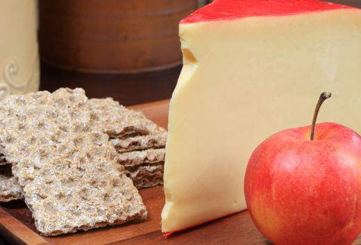 Gouda cheese is often served with fruit and crackers.