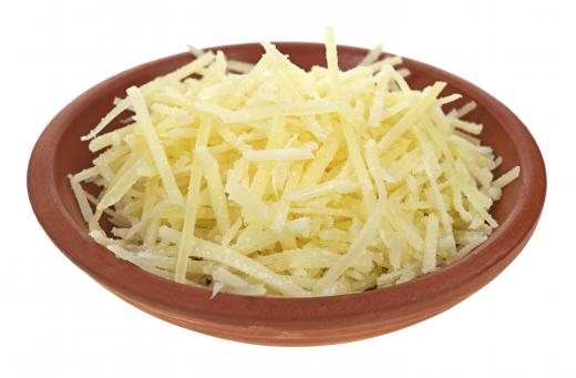 Small bowl of grated parmesan cheese.