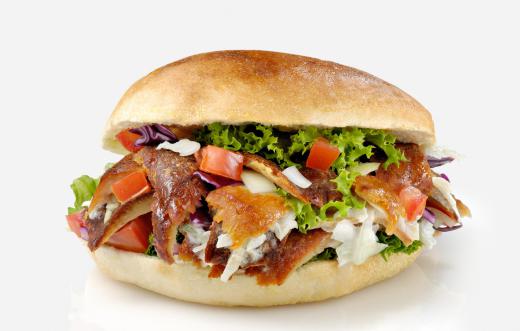 Pita bread, sliced meat, cucumbers, onion, tomato and sauce is often served as street food.