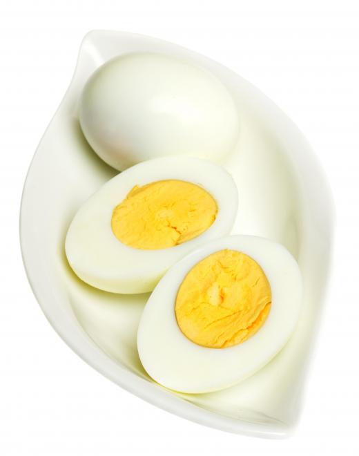 Hard boiled eggs, which can be served with wilted lettuce.