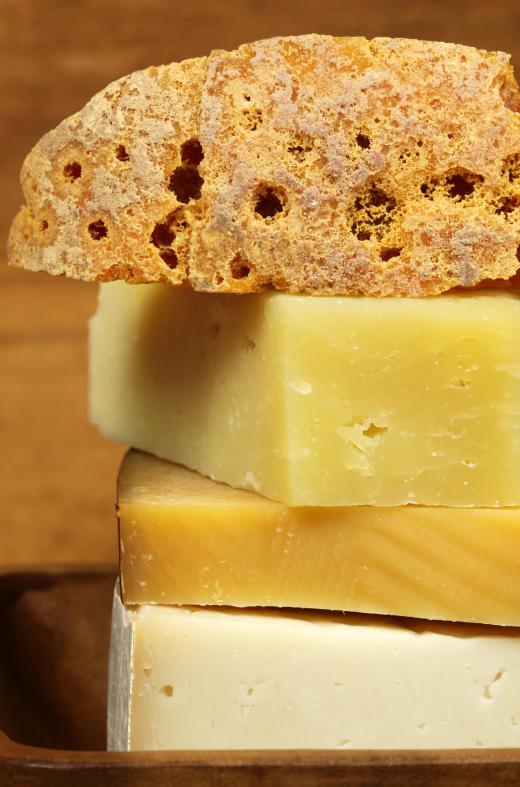 Hard cheeses should be placed on the outside of a cheese board.