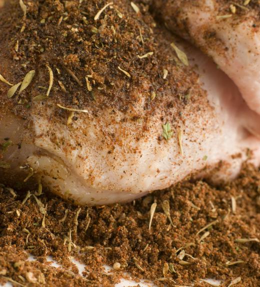 Boneless chicken thighs can be seasoned using a dry rub of herbs and spices.