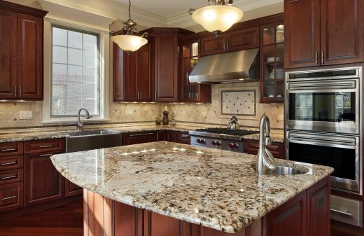 A double wall oven across from a kitchen island.