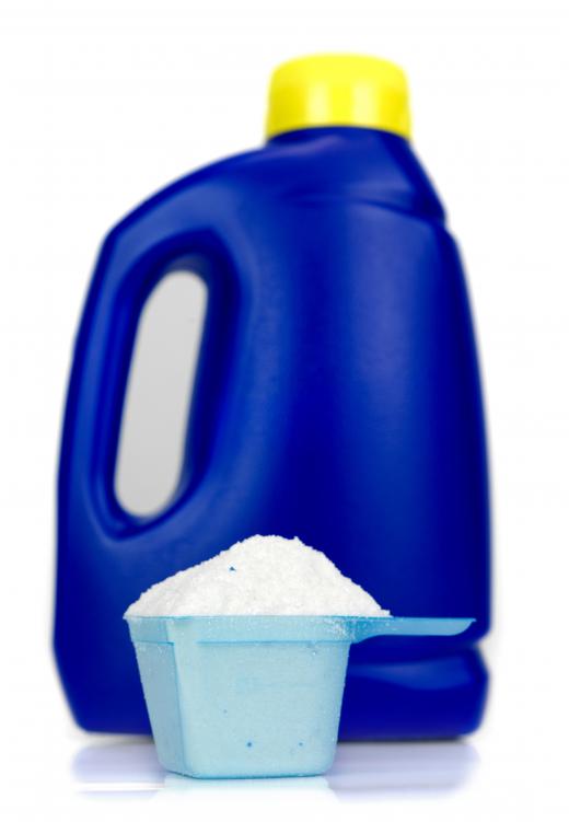 A bottle and cup of laundry detergent. Citric salts are often added to laundry detergent to make it more effective.