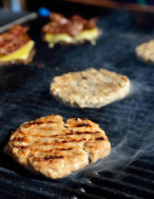 An electric grill is safer to cook meat because it doesn't leave a residue the way charcoal does.