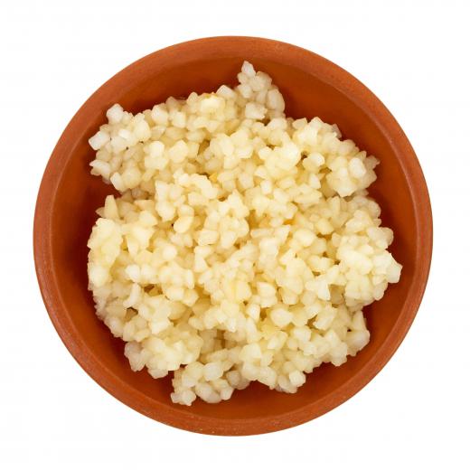 Garlic is commonly minced to release its juices into a food dish to distribute flavor.