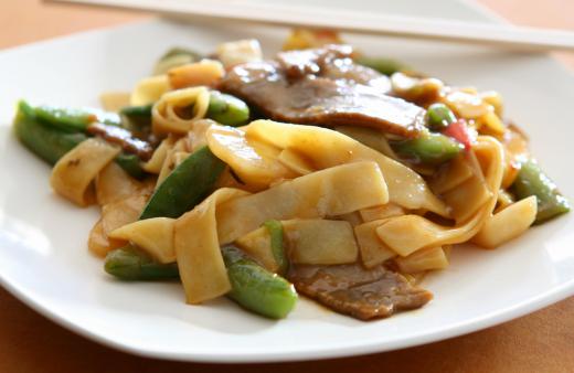 Beef, rice noodles and bean sprouts are used to make beef chow fun.